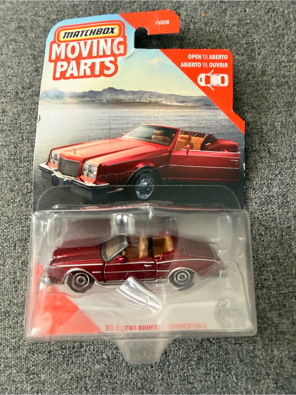 Match red convertible die-cast with tan interior